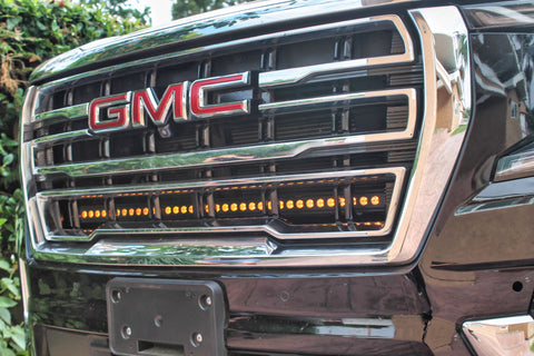 GMC Yukon 2021-24 Single 40in Light Bar installed under GMC logo on the front grille of a black GMC Yukon.