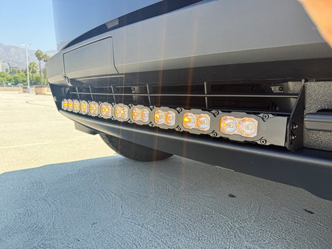 up close view black tesla cybertruck with amber LED light bar m&r automotive 