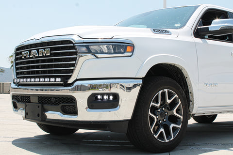 white 2025 ram 1500 with LED light bar on top bumper and fog lights