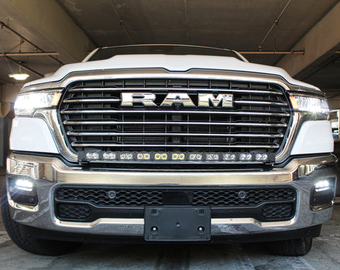 white 2025 ram 1500 with LED light bar on top bumper and fog lights