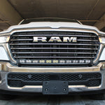 white 2025 ram 1500 with LED light bar on top bumper and fog lights amber