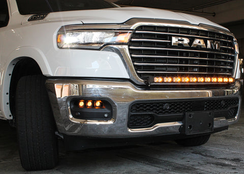 white 2025 ram 1500 with LED light bar ambeer drl and fog lights ambeer backglow