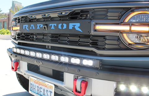 upclose view ford bronco raptor with white curved led light bar on top of bumper