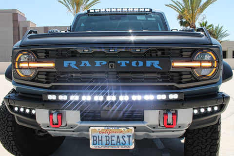 front view ford bronco raptor with white led light bar on bumper and roof plus fog lights