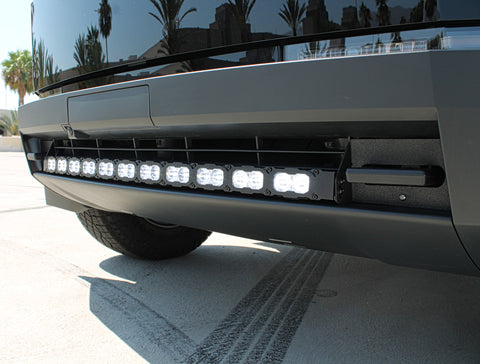 close up view black tesla cybertruck with curved white LED light bar m&r automotive 