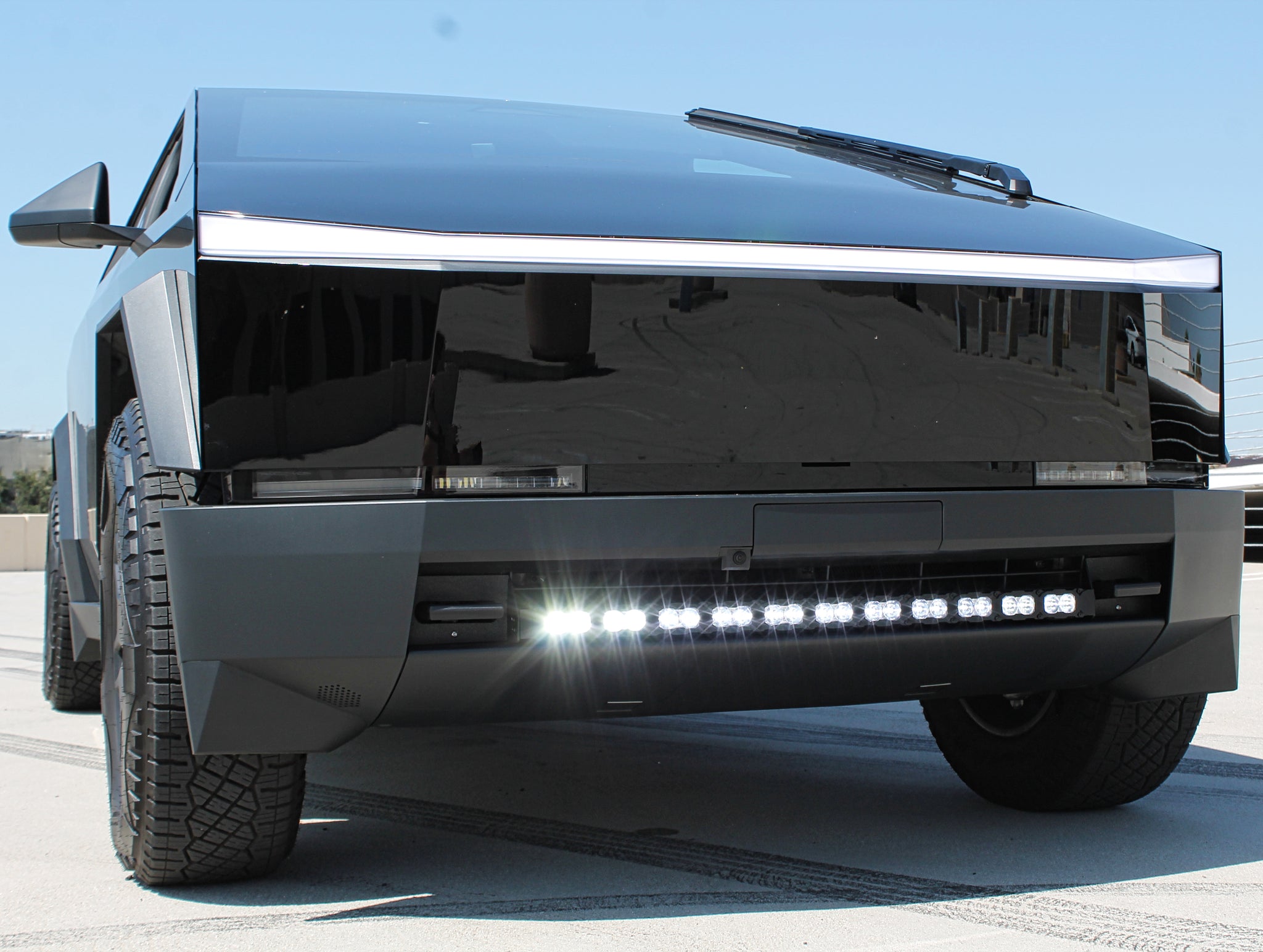 black tesla cybertruck with white LED light bar m&r automotive 