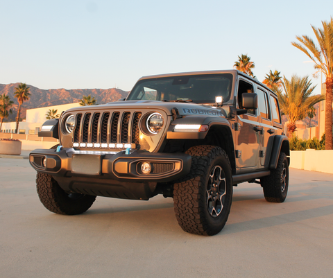 2024 jeep wrangler with LED light bar in the front grille and white ditch lights