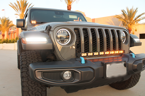 2024 jeep wrangler with amber LED light bar in the front grille and amber day time running lights hood mount kit