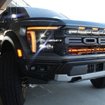 2024+ Ford Raptor ditch lights Gen 3 Refresh A-Pillars on bold black Ford Raptor front grille with amber DRL and dual-function LED pods