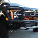 2024+ Ford Raptor ditch lights Gen 3 Refresh A-Pillars on bold black Ford Raptor front grille with amber DRL and dual-function LED pods