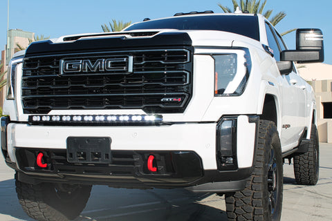 white gmc sierra 2500 3500 HD with a curved LED light bar in front of the grille