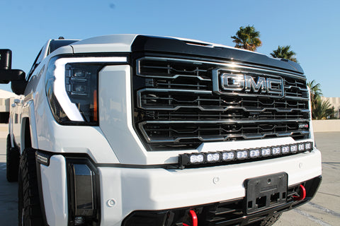 white gmc sierra 2500 3500 HD with a curved LED light bar in front of the grille