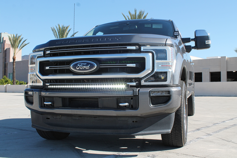 2021 gray ford super duty with white LED light bar on the bumper