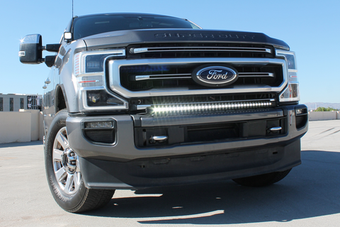 2021 gray ford super duty with white LED light bar on the bumper