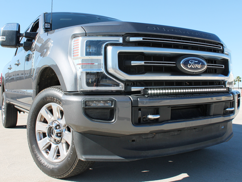 2021 gray ford super duty with white LED light bar on the bumper