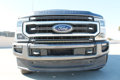 2022 gray ford super duty with LED light bar on the bumper