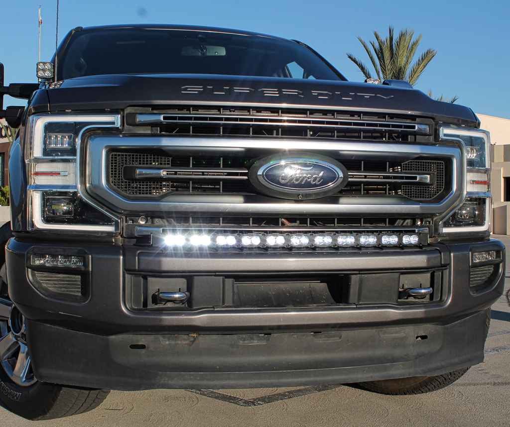 grey 2021 ford super duty with LED light bar on top of the bumper white color