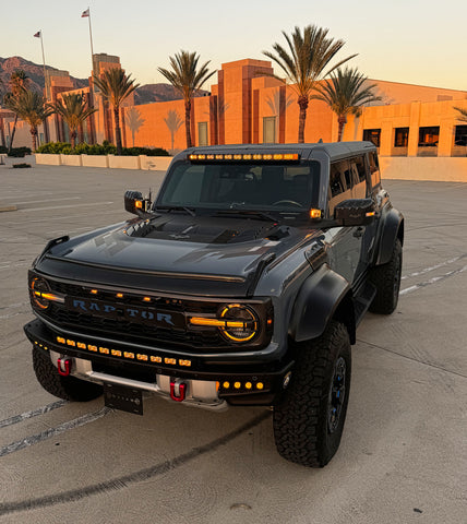 top view gray ford bronco raptor with amber drl on light bars