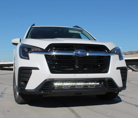 white subaru ascent with white led light bar behind grille