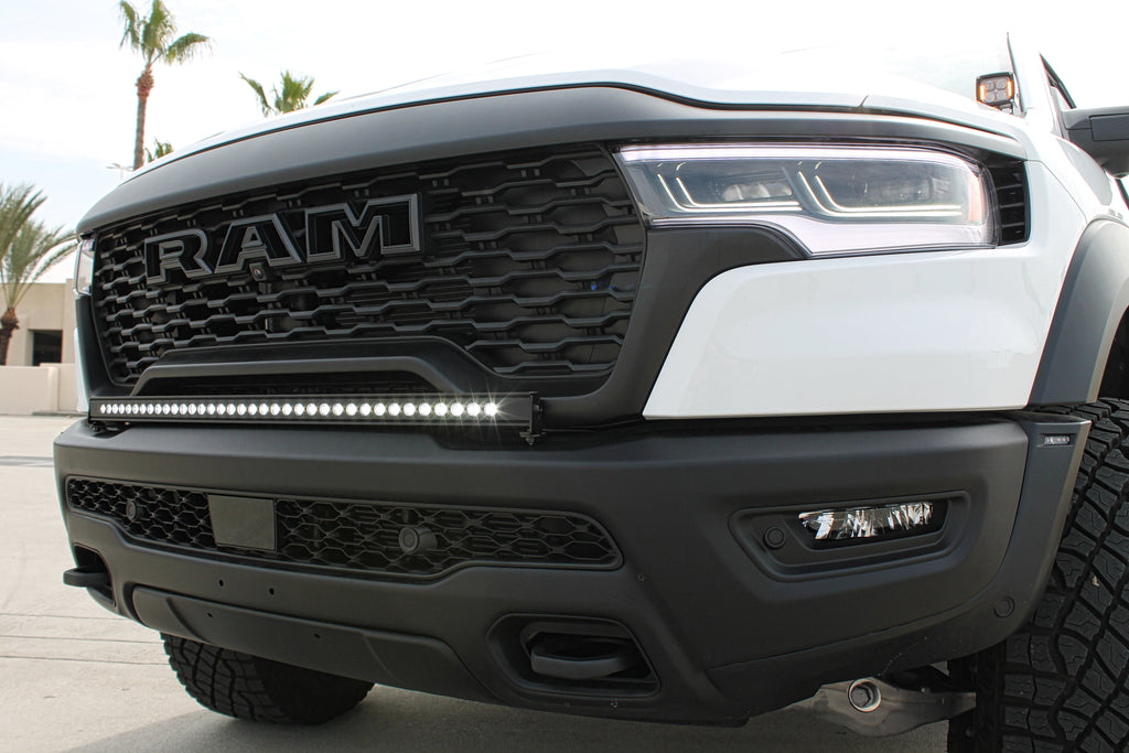 white ram 1500 rho with white light bar and ditch lights