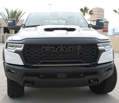 white ram 1500 rho with light bar on the bumper and hood mount kit