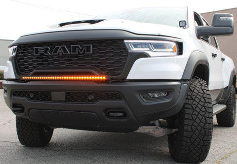 white ram 1500 rho with light bar on the bumper and hood mount kit