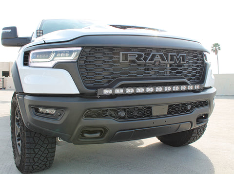 white ram rho with ditch lights, fog lights and light bar for off roading