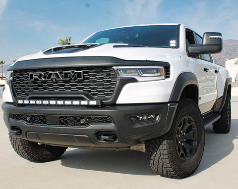 white ram rho with ditch lights, fog lights and light bar for off roading