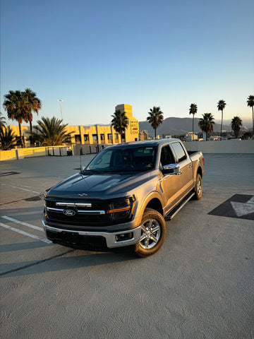 top view grey 2024 ford f150 with white led light bar behind the grille