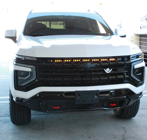 white 2025 chevrolet tahoe with light bar behind the grille for off roading, chevy suburban lights