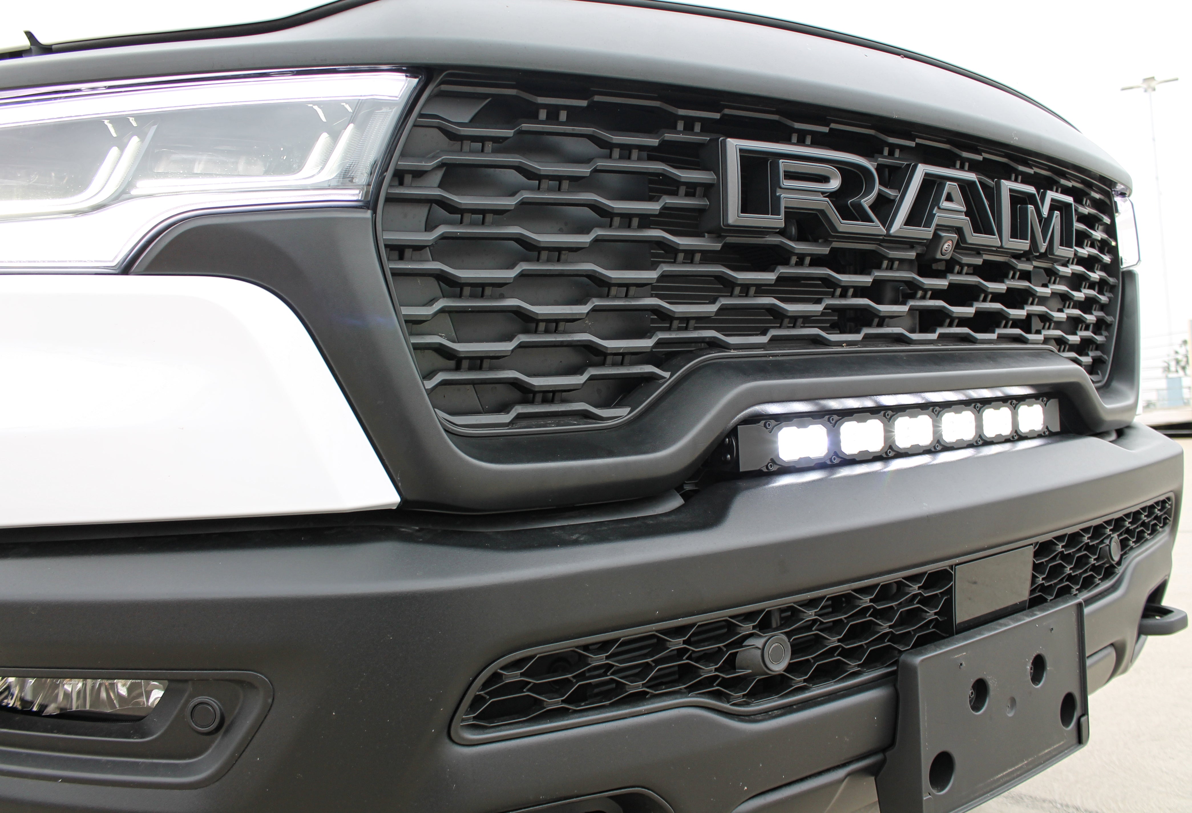 2025 white ram 1500 rho with light bar white for off roading
