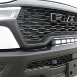 RAM RHO light bar PRO 23in curved LED installed between grille and bumper on 2025 RAM 1500 RHO front view