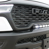 RAM RHO light bar PRO 23in curved LED installed between grille and bumper on 2025 RAM 1500 RHO front view