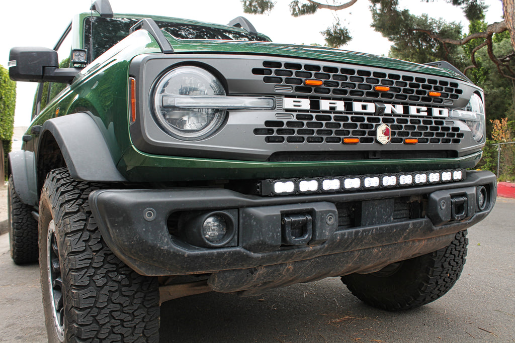 green 2021 bronco capable bumper with white led light bar installed on top for off roading