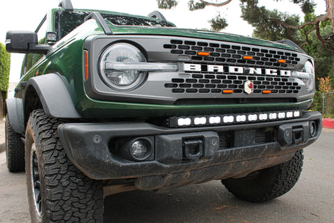 green 2021 bronco capable bumper with white led light bar installed on top for off roading