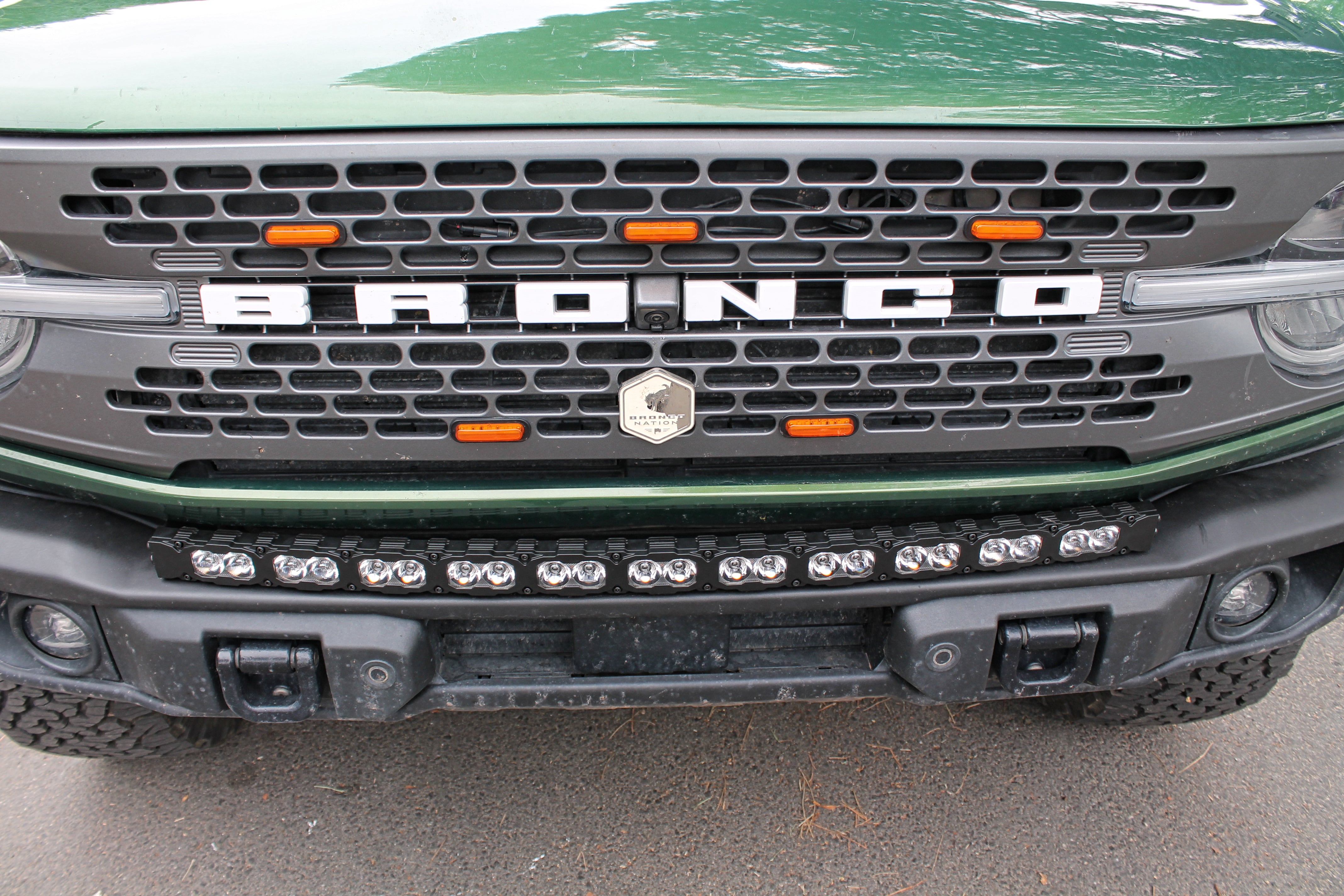 top view green 2021 bronco capable bumper with led light bar installed on top for off roading