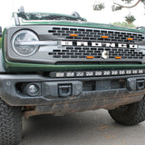 green 2021 bronco capable bumper with led light bar installed on top for off roading