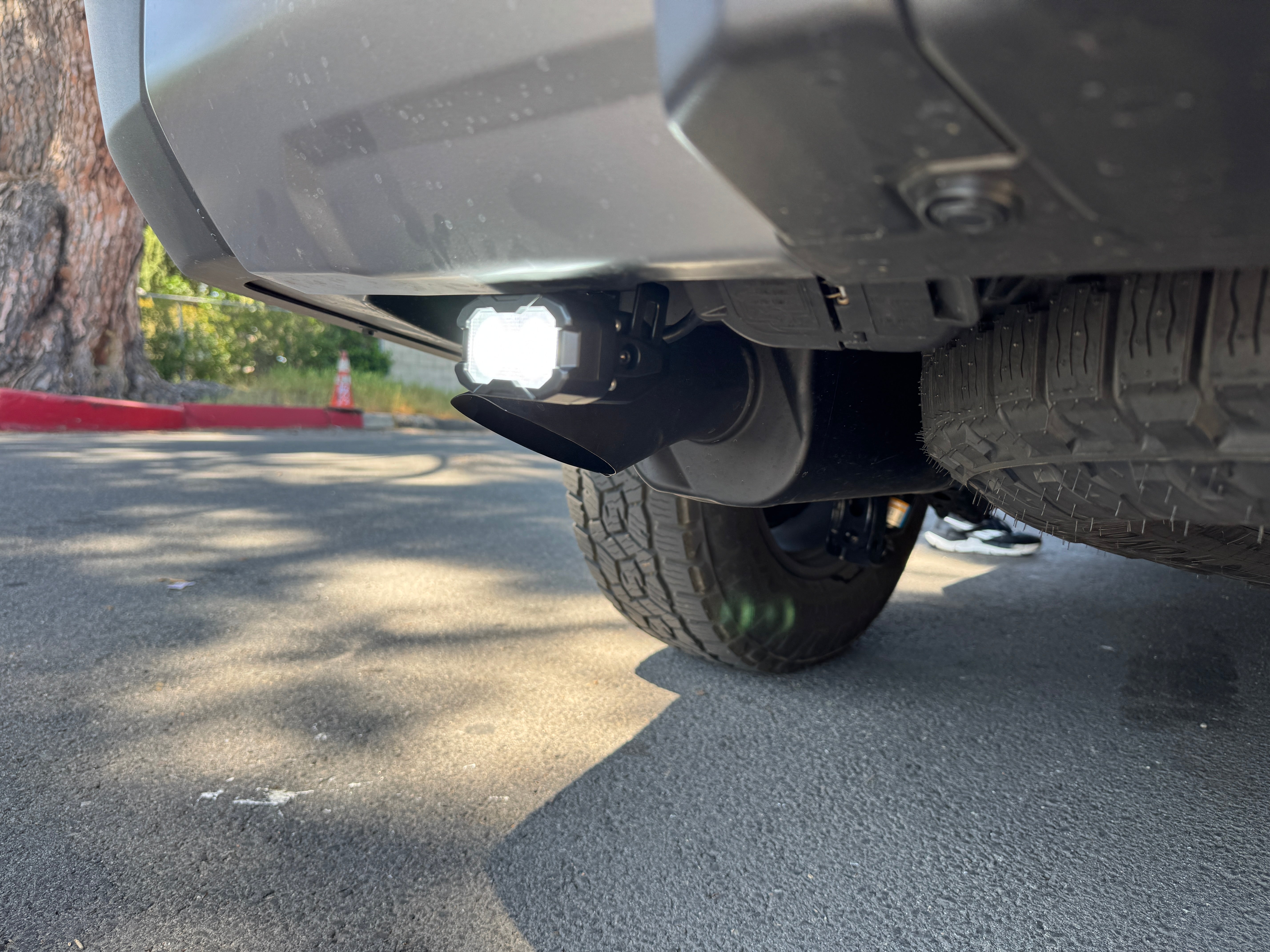 Lexus GX550 Reverse light kit: White LED pod with amber or red backlight option installed on rear bumper for 2024+ GX550 models