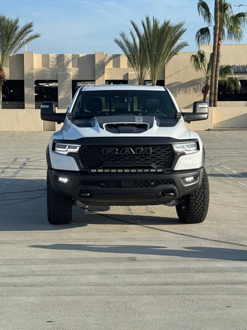 2025 white ram 1500 rho with off roading lights