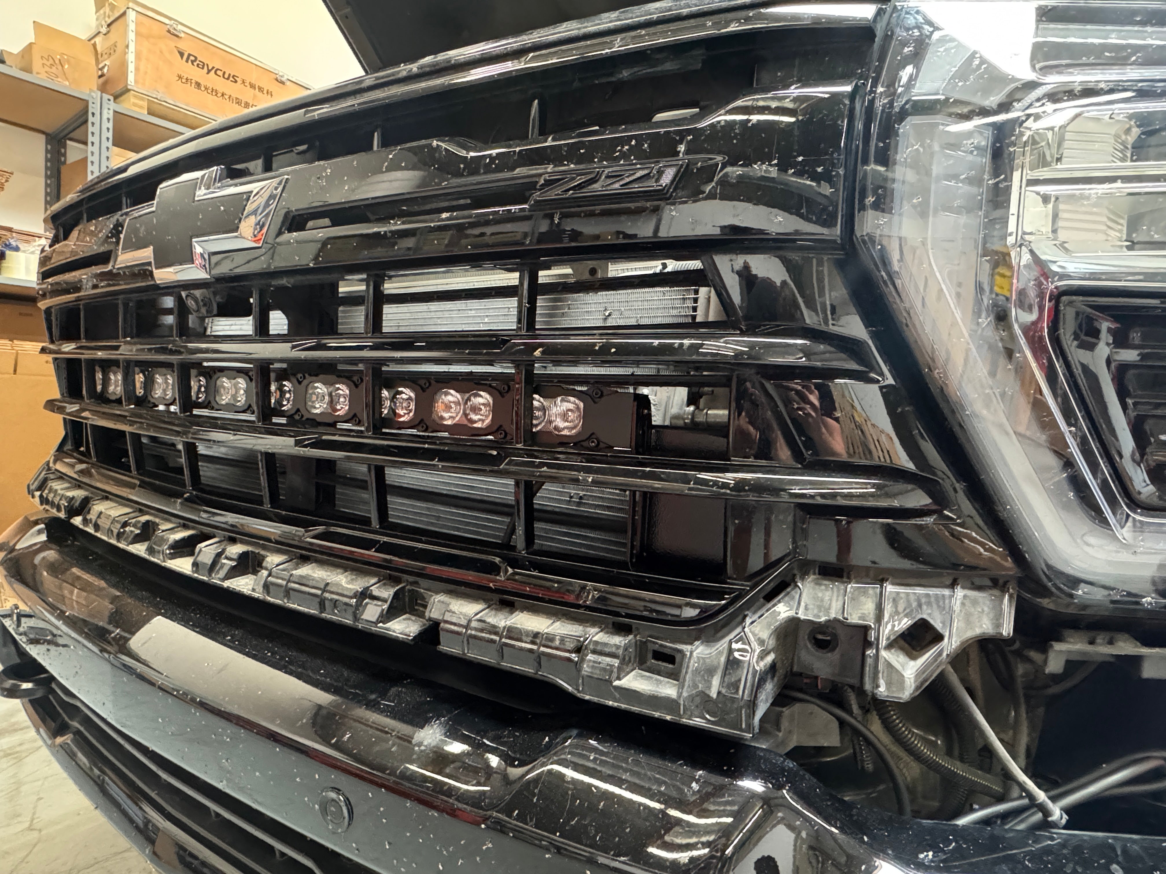 Silverado 2500 3500 light bar installed behind lower grille on 2020-2026 Chevy Silverado 2500HD 3500HD front bumper
