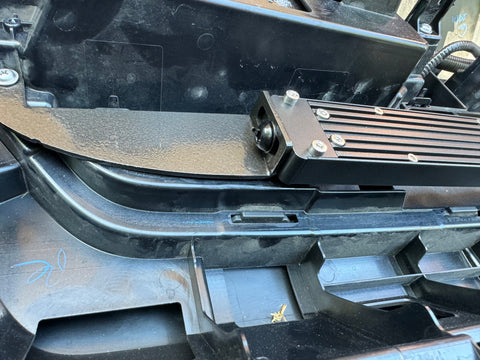 behind grille of new toyota tacoma 2024 showing metal bracket for led light bars 