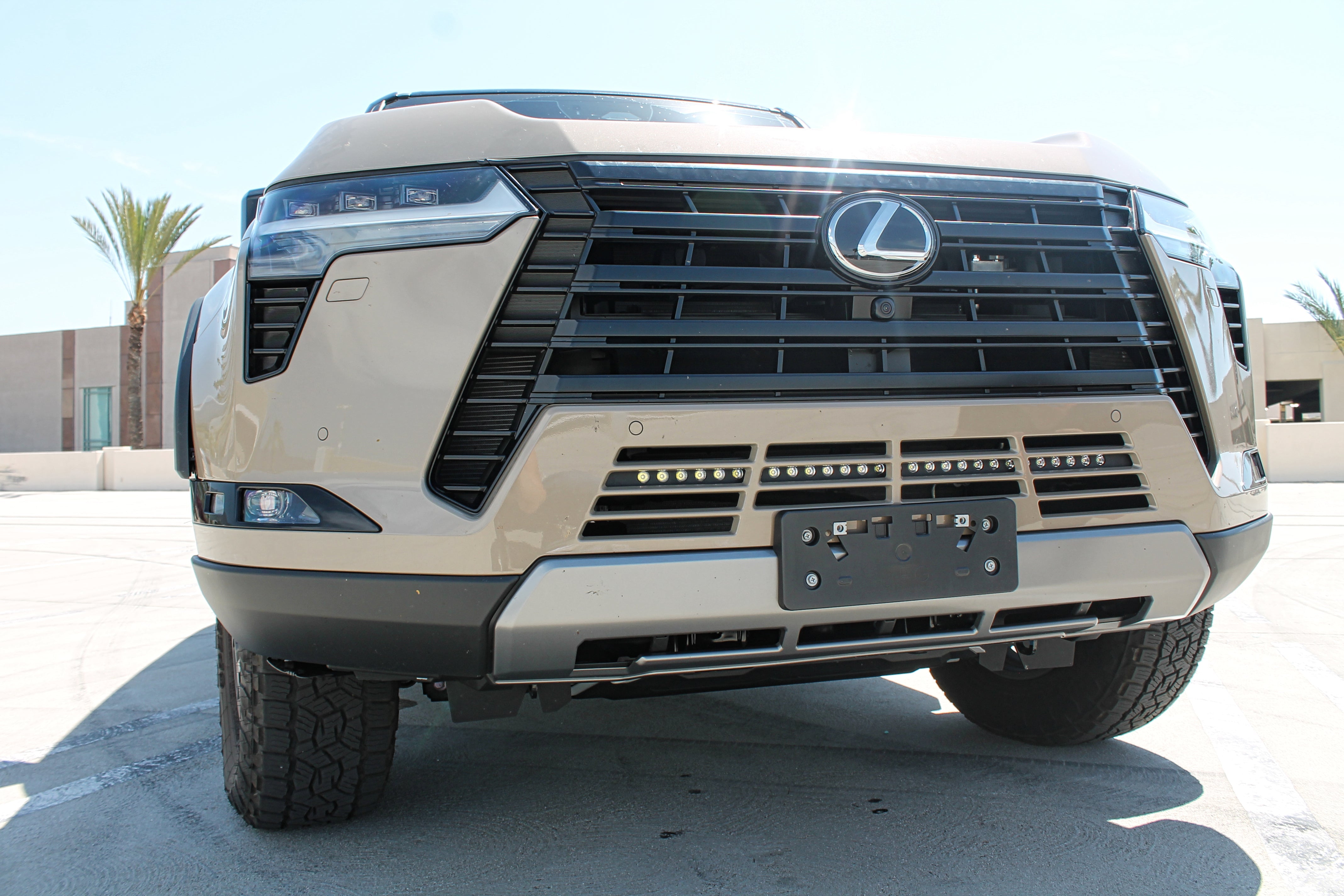 Lexus GX550 lightbar on 2024+ model with front view showing slim 30in light bar behind grille