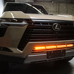 Lexus GX550 lightbar on 2024+ GX550 front grille shot, slim 30in LED light bar mounted behind lower grille, not affecting radiator cooling