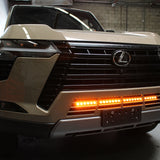 Lexus GX550 lightbar on 2024+ GX550 front grille shot, slim 30in LED light bar mounted behind lower grille, not affecting radiator cooling