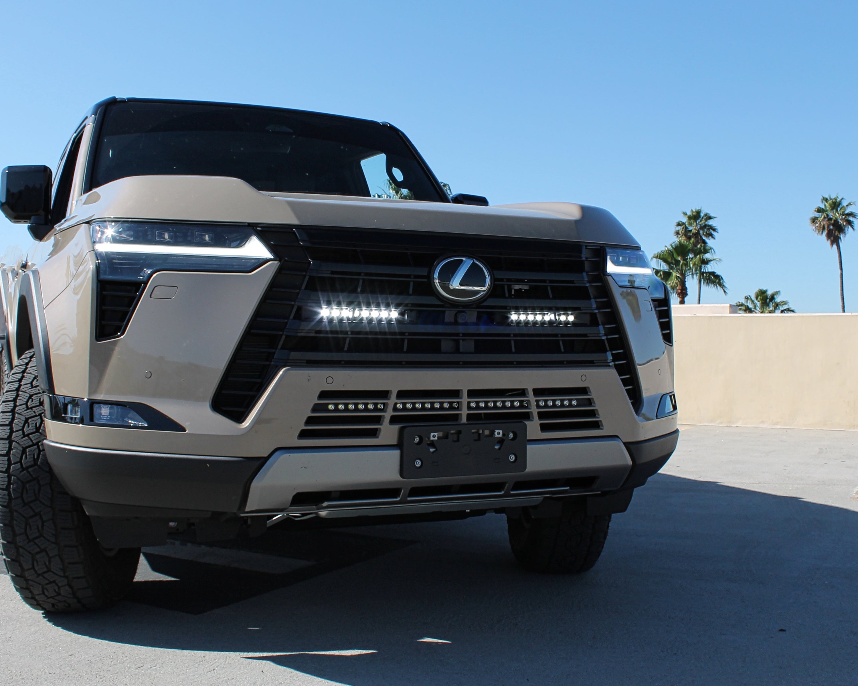 Lexus GX550 light bar installed behind front grille on 2024+ GX550 models with white LED bars for high visibility
