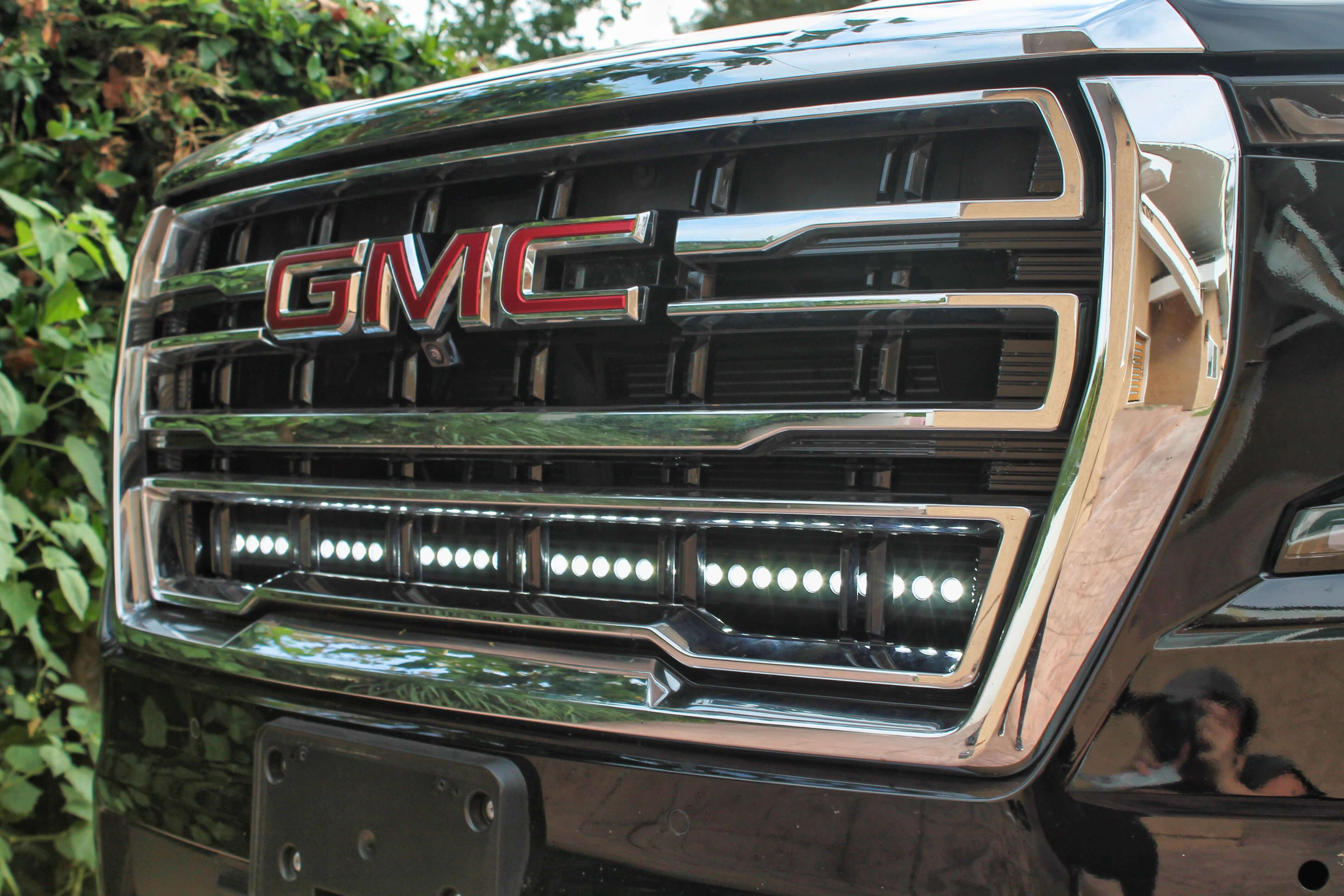GMC Yukon 2021-24 single 40in light bar installed under the GMC logo on a black grill.