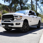 2025+ RAM 2500 light bar installed on white RAM 2500 truck, slim 40in curved LED light bar front view on road