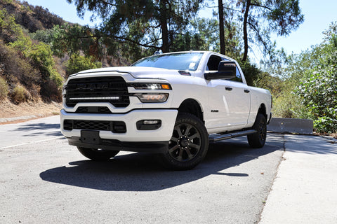 2025+ RAM 2500 light bar installed on white RAM 2500 truck, slim 40in curved LED light bar front view on road