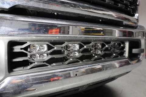 RAM 2500 lightbar Bumper Light kit installed with LED lower grille light pods on 2019-2024 RAM 2500 HD truck front bumper