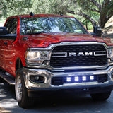 RAM 2500 lightbar Bumper Light kit installed on red RAM 2500 lower grille light pods 2019-2024 on forest road
